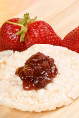 Rice cake with jam and strawberries