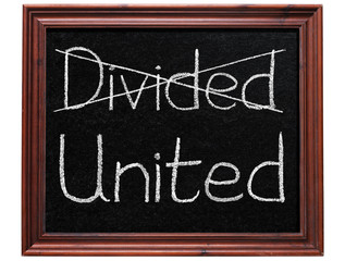 Crossing out divided and writing united.