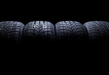 Fototapeta Car tires isolated on black background obraz
