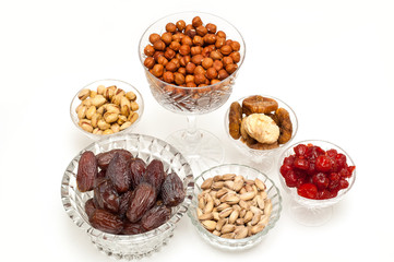 Dry fruits and nuts on a white background