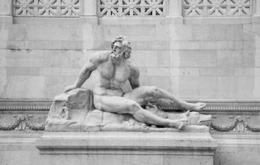 naked male statue, which sits