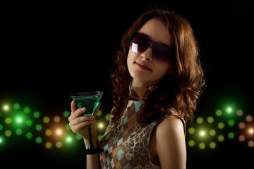 young woman with a green cocktail