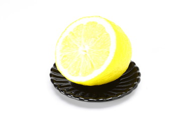 Lemon on black plate