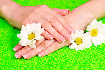 Obraz na płótnie Canvas Beautiful hand with perfect nail french manicure on towel backg