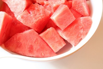 Watermelon chunks in a white bowl