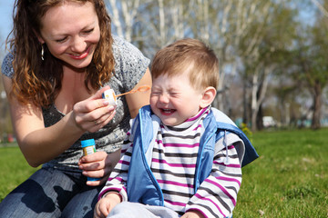 litlle boy with mother in the park