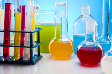 Laboratory flasks with fluids of different colors