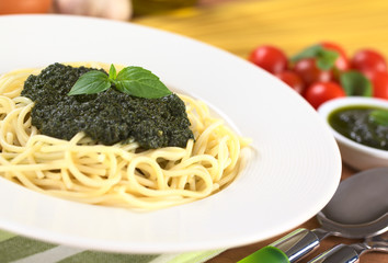 Spaghetti with fresh pesto made of basil, garlic and olive