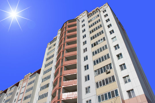 The inhabited high house against the blue sky