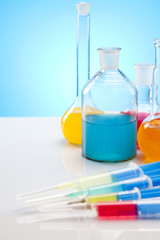 Laboratory flasks with fluids of different colors
