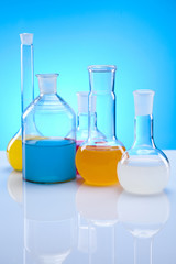Laboratory flasks with fluids of different colors