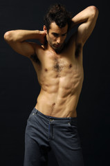 Fototapeta premium Sport and health body of young man on black