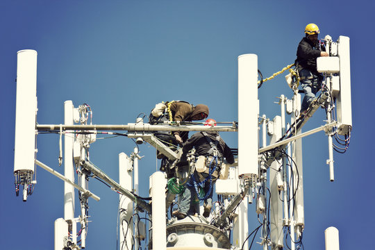 Crew installing antennas