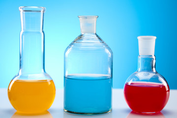Laboratory flasks with fluids of different colors
