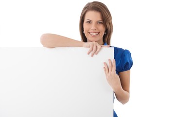 Laughing attractive woman with blank sheet