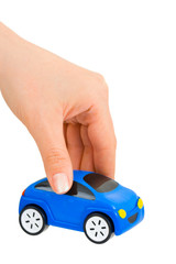 Hand and toy car