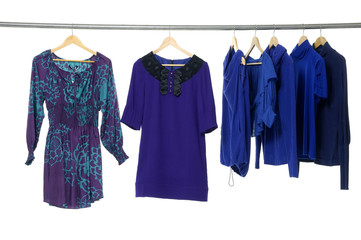 Fashion blue clothing on hanger in a row