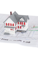 Close-up of toy house model on a plan
