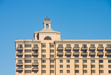 Classic Brown Hotel Against Blue Sky