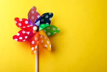 Windmill toy isolated on yellow background