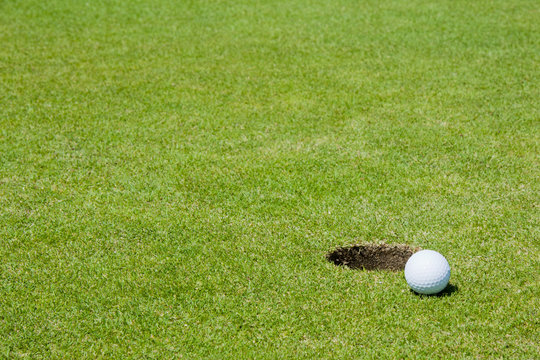 Golf Ball Close To Hole