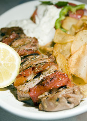 pork souvlaki with tzatziki taverna food Greece