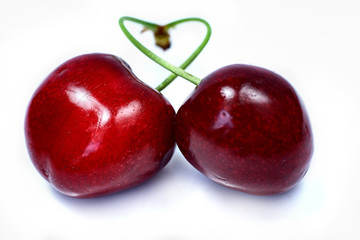 Fresh two cherries isolated on a white background