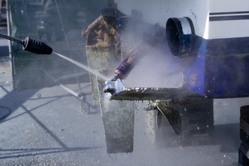 blue boat hull cleaning pressure washer barnacles