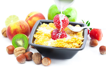 strawberry, peach, nuts,apple, kiwi, milk and flakes in a bowl i