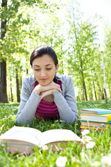 girl reading a book outdoor