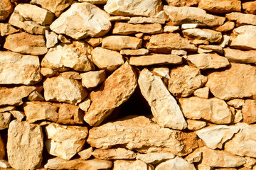 aged masonry stone wall triangle window hole