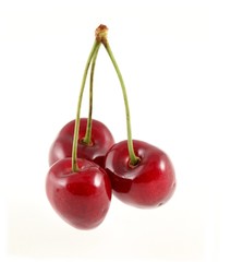 Three cherries on a white background