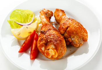 Roasted chicken drumsticks and vegetables