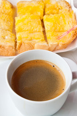 Breakfast with coffee and bread on the table