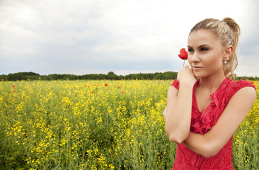 Beautiful woman on green meadow