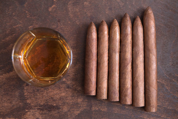 cigars and whiskey on the table