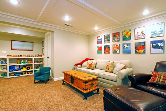 Play room in a  white basement living room