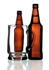 Glass mug and two bottles of beer, isolated
