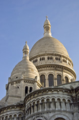 Basilica of Sacre Coeur in Paris. Against the blue sky.