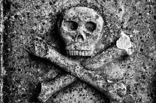 Skull and Cross bones on an old grave