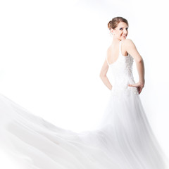 Fototapeta na wymiar beautiful bride in a luxurious wedding dress