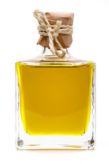 Yellow liquid, olive oil, in a small glass bottle, traditional r