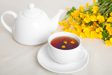 Cup of tea with teapot