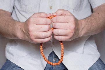 Hands plucked the rosary