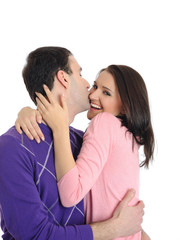 pretty young couple in love embracing. isolated on white backgro