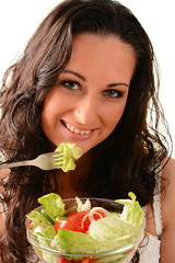 Young woman with vegetable salad bowl