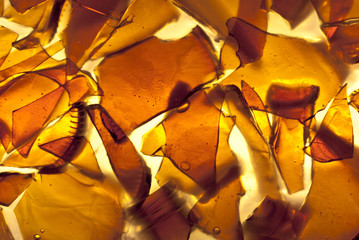 Amber glass fragments set in resin