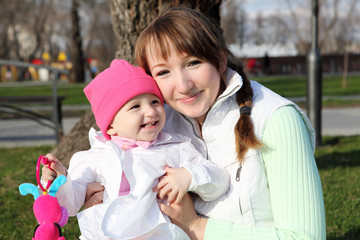 litlle girl with mother in the park