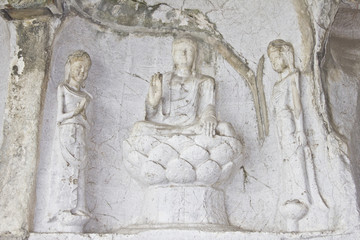 Buddha carved on a rock