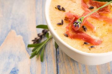 fresh melon soup with parma ham and lavender flower